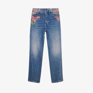 Flat lay image of flower embellished jeans