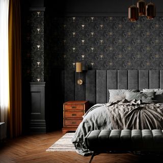 Bedroom with dark wallpaper with metallic accents, pendant light and wide velvet headboard