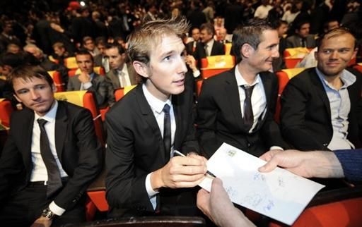 Andy Schleck signs an autograph