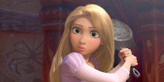 Rapunzel looks hesitant as she holds a frying pan in Tangled