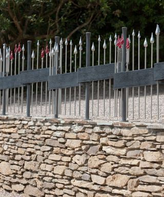 stone wall with bespoke metal railings