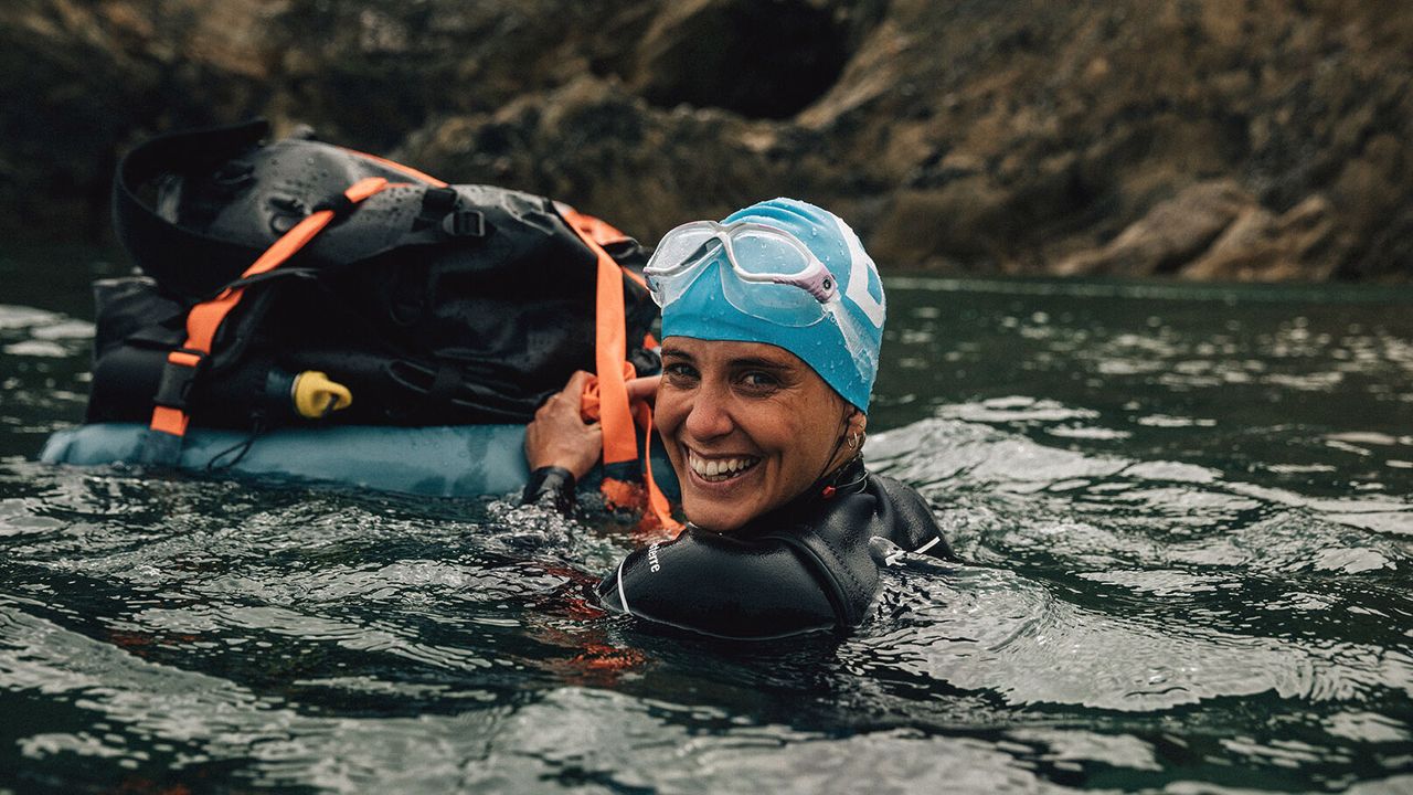 Woman swimming with a RuckRaft