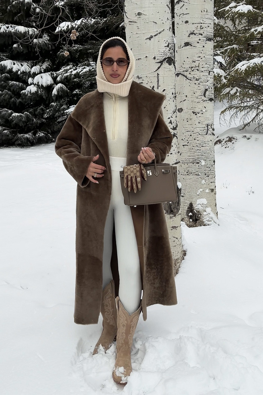 Bettina Looney wearing fur jacket in the snow