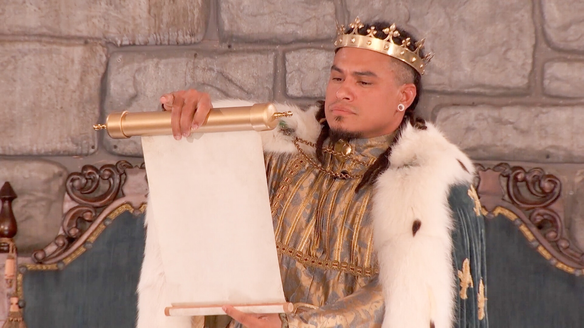 Keanu dressed as a king, holding a scroll in Big Brother Season 28