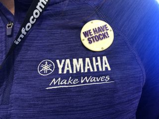 Yamaha UC wanted to ensure you didn’t miss that message, so the staff was wearing flashing buttons “We Have Stock.”