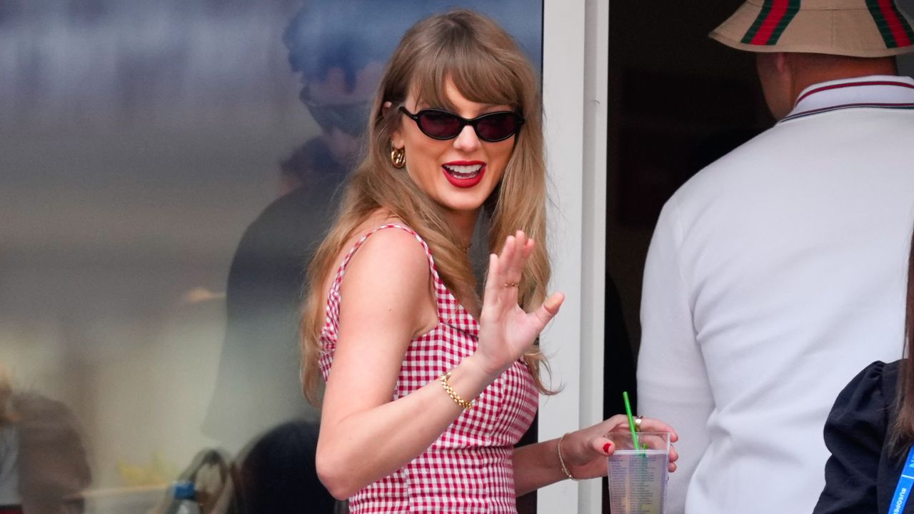 Taylor Swift going into her US Open suite with travis kelce wearing a reformation dress