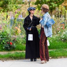 Parisian guests at Paris Fashion Week stood in a flower garden