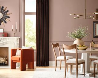 traditional living dining space with muted pink walls and modern decor