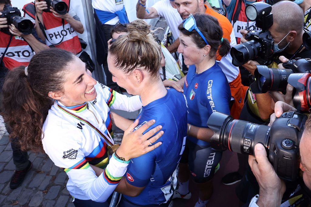Gold medallist Italys Elisa Balsamo L wearing her World champions rainbow jersey celebrates with teammates after winning the womens elite cycling road race 1577km from Antwerp to Leuven on the seventh day of the Flanders 2021 UCI Road World Championships on September 25 2021 in Leuven Photo by Kenzo Tribouillard AFP Photo by KENZO TRIBOUILLARDAFP via Getty Images