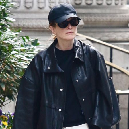 Julianne moore wears a black hat, black t-shirt, and a black leather jacket.