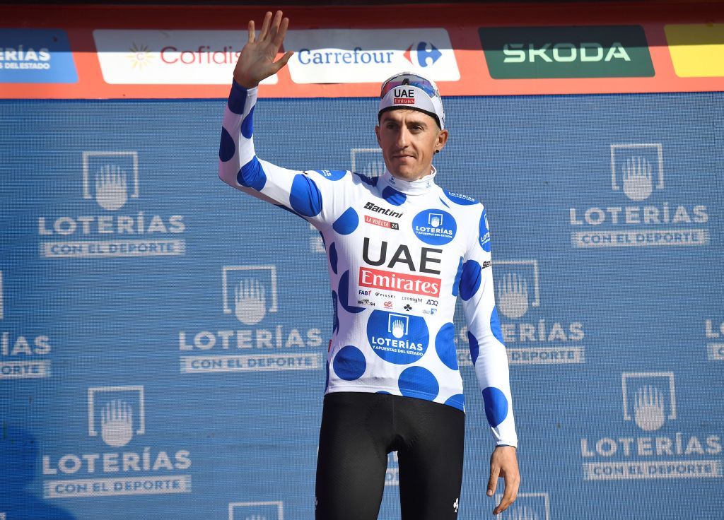 Team UAE's Marc Soler wearing the climber ranking leader celebrates on the podium after the stage 19 of the Vuelta a Espana, a 173,5 km race between Logrono and Alto de Moncalvillo, on September 6, 2024. (Photo by ANDER GILLENEA / AFP)