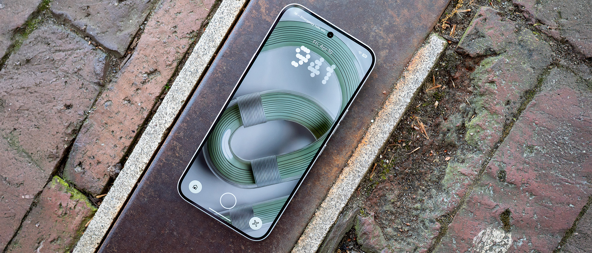 A green wallpaper on the lockscreen of the Nothing Phone 4a Pro