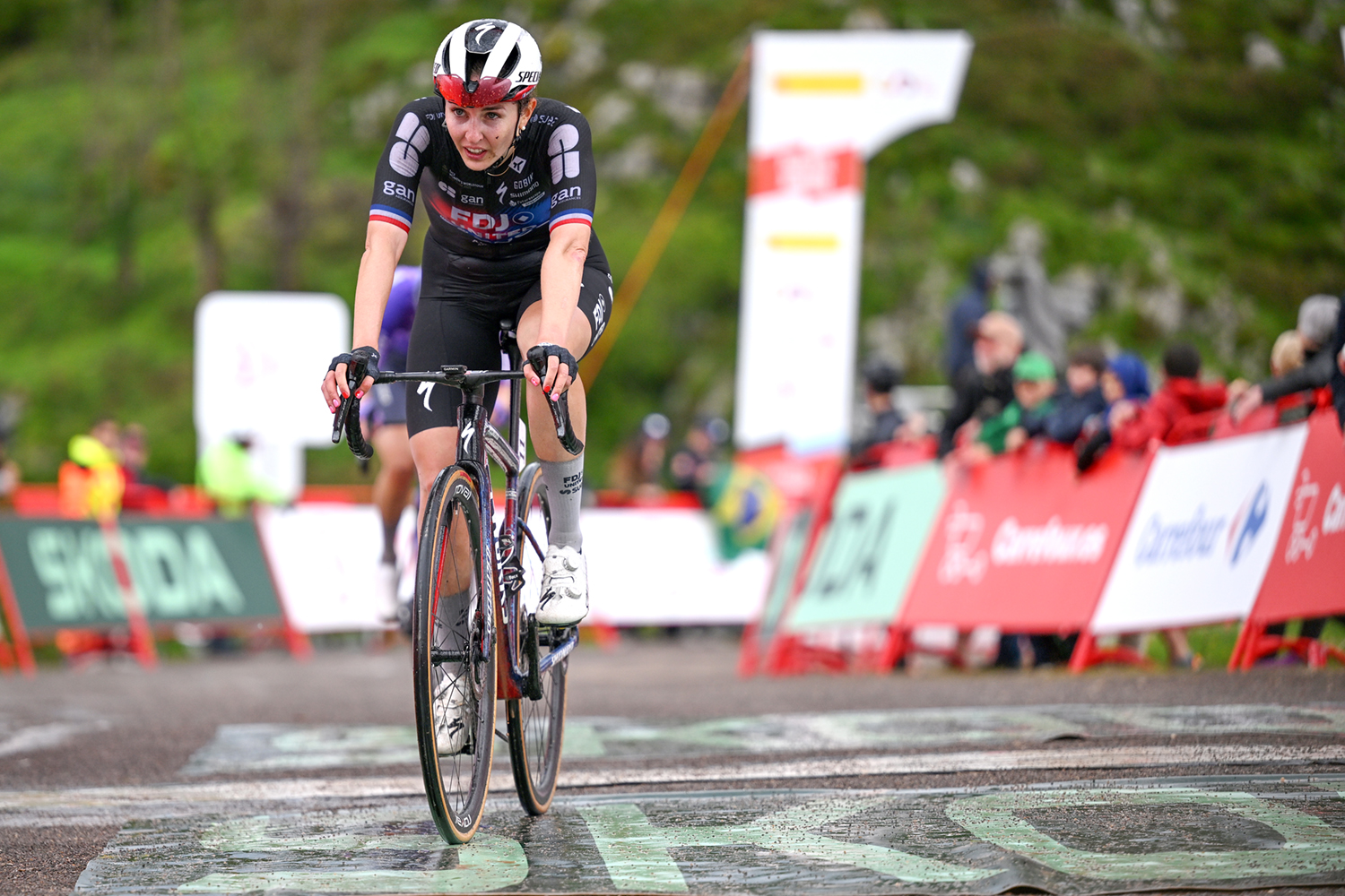 Juliette Berthet crosses the line at Les Praeres to finish stage 6 of La Vuelta Femenina 2026