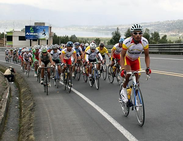 The local lads stack the front of the field as the road heads up.