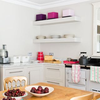 open kitchen with white wall and shelving