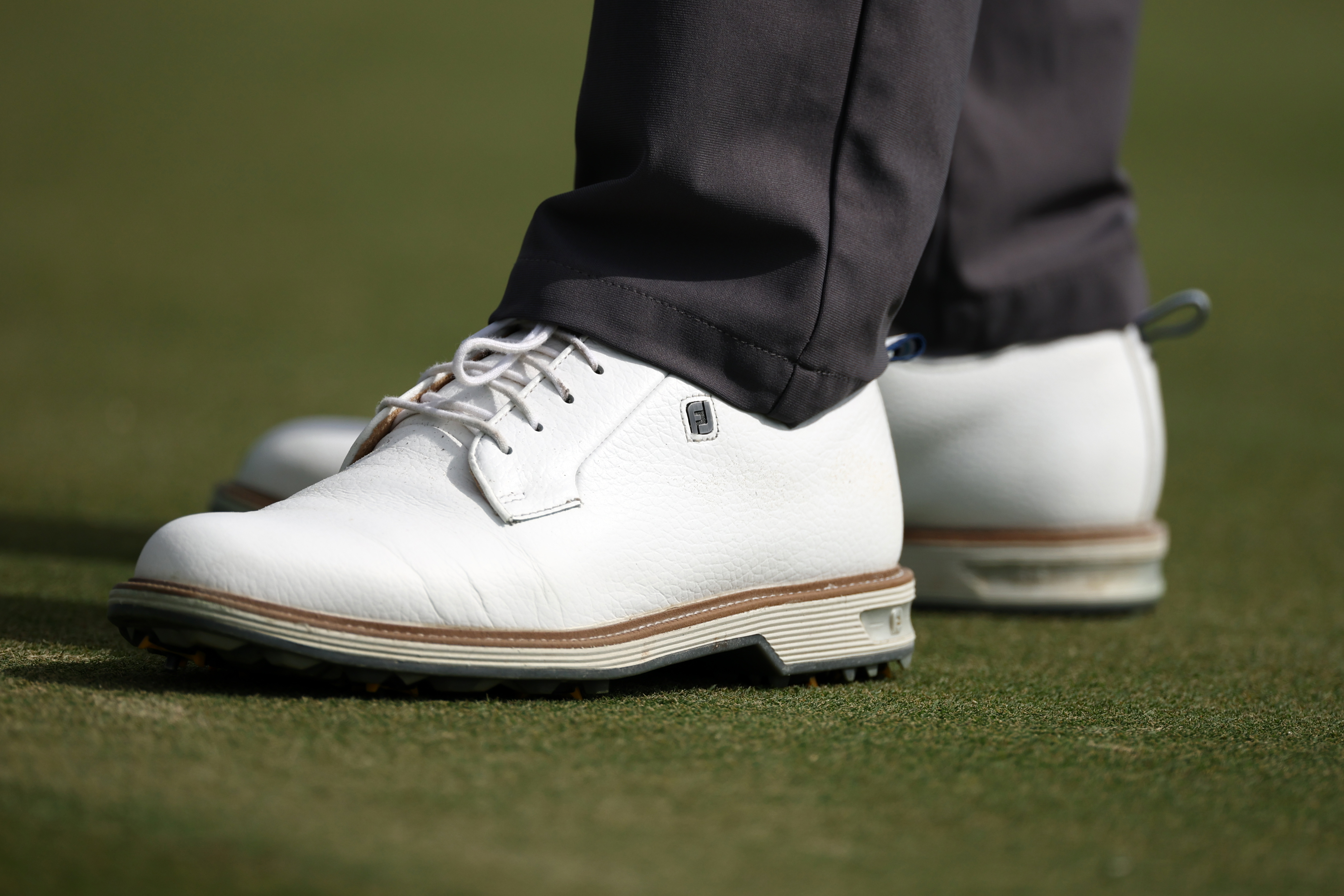 A detail view of the shoes of Wyndham Clark on the second green during the first round of the Hero World Challenge