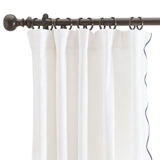 A cotton scalloped edge curtain 