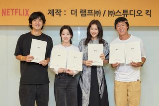 The cast of 'Aema' poses while holding scripts.