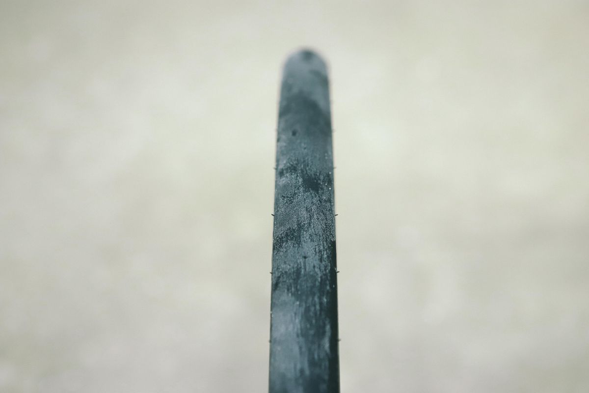 a close up of a black road bike tyre