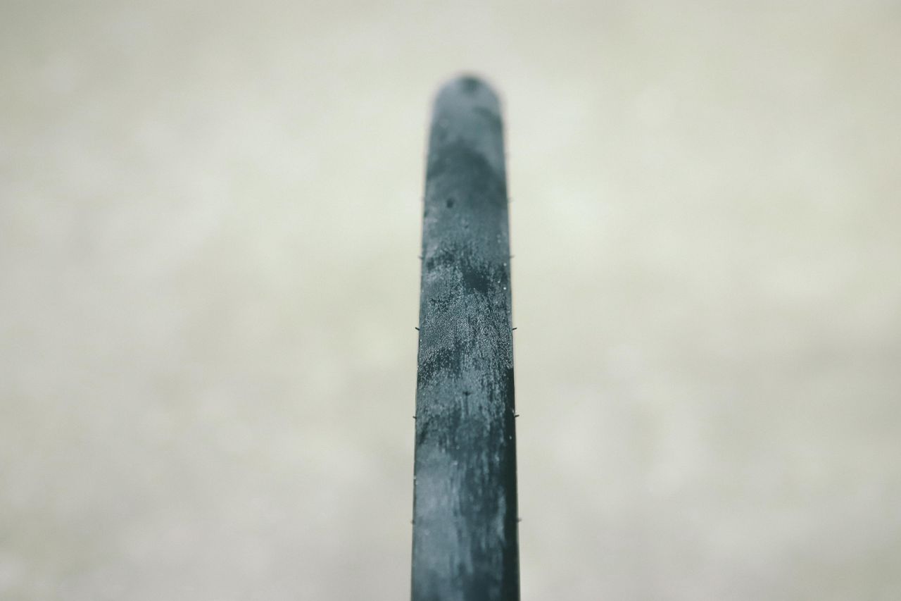 a close up of a black road bike tyre