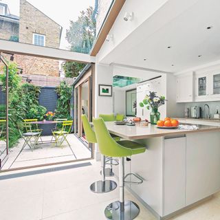 Kitchen extension with fixed glazed roof, and bifold doors to the patio