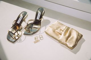 Marissa Bode's gold accessories for the Wicked premiere including Jimmy Choo shoes and gold rings