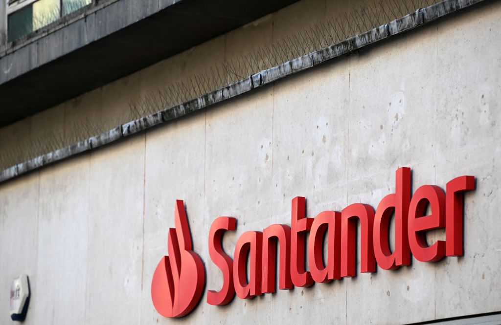 Santander bank sign on a grey wall