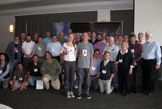 International Space Elevator Consortium (ISEC) participants, including Elevator Speech winners Lana and Campbell Gorlinski, holding their prizes — Amazon.com gift cards.