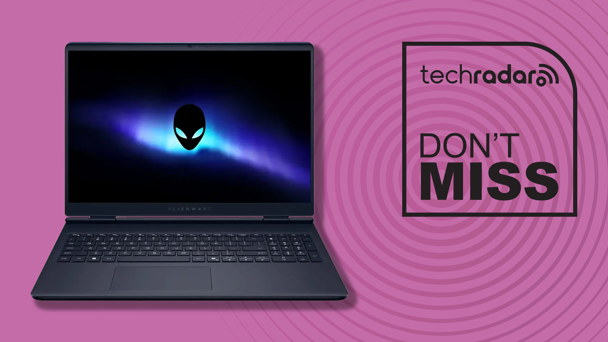 An Alienware laptop against a pink TechRadar background