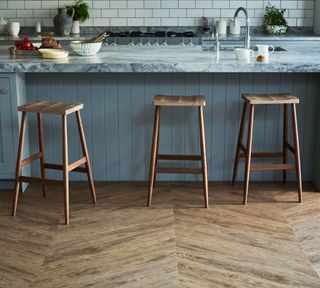 Roost - a kitchen island in a contemporary kitchen with bar stools - Amtico flooring