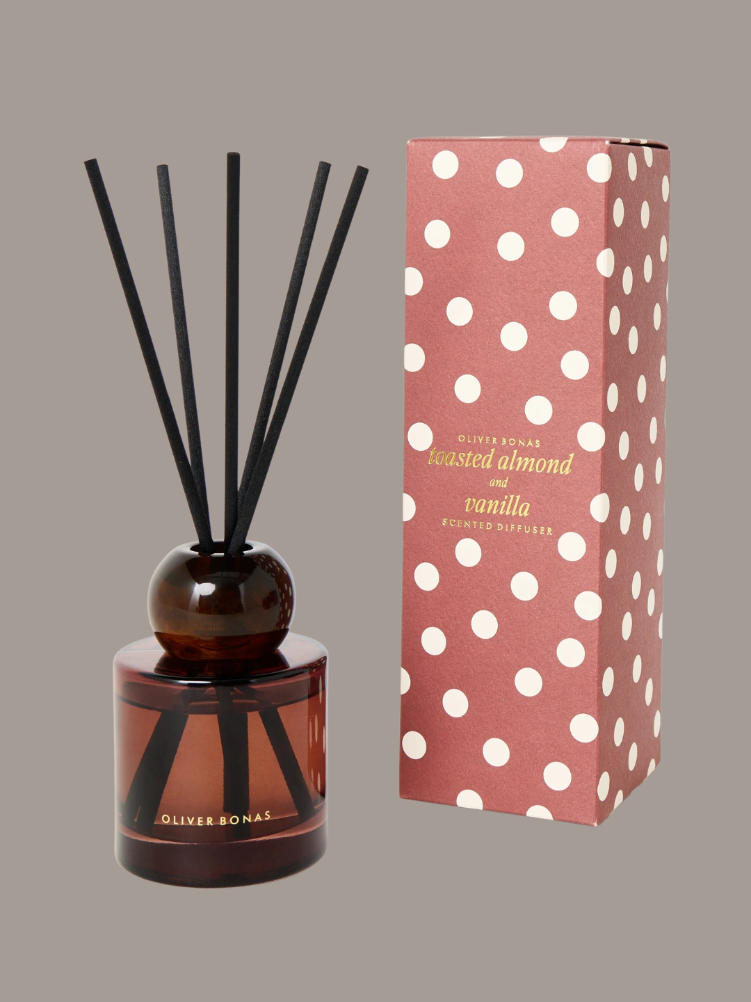 A brown glass almond and vanilla reed diffuser from Oliver Bonas