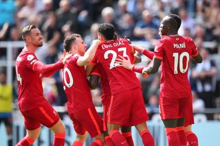 Liverpool players celebrate Naby Keita's goal against Newcastle.