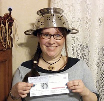 A woman creates a stir when she won the right to wear a strainer on her head in her drivers license photo.