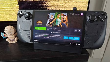 Antank 6-in-1- Steam Deck dock with handheld connected next to Gollum figure.