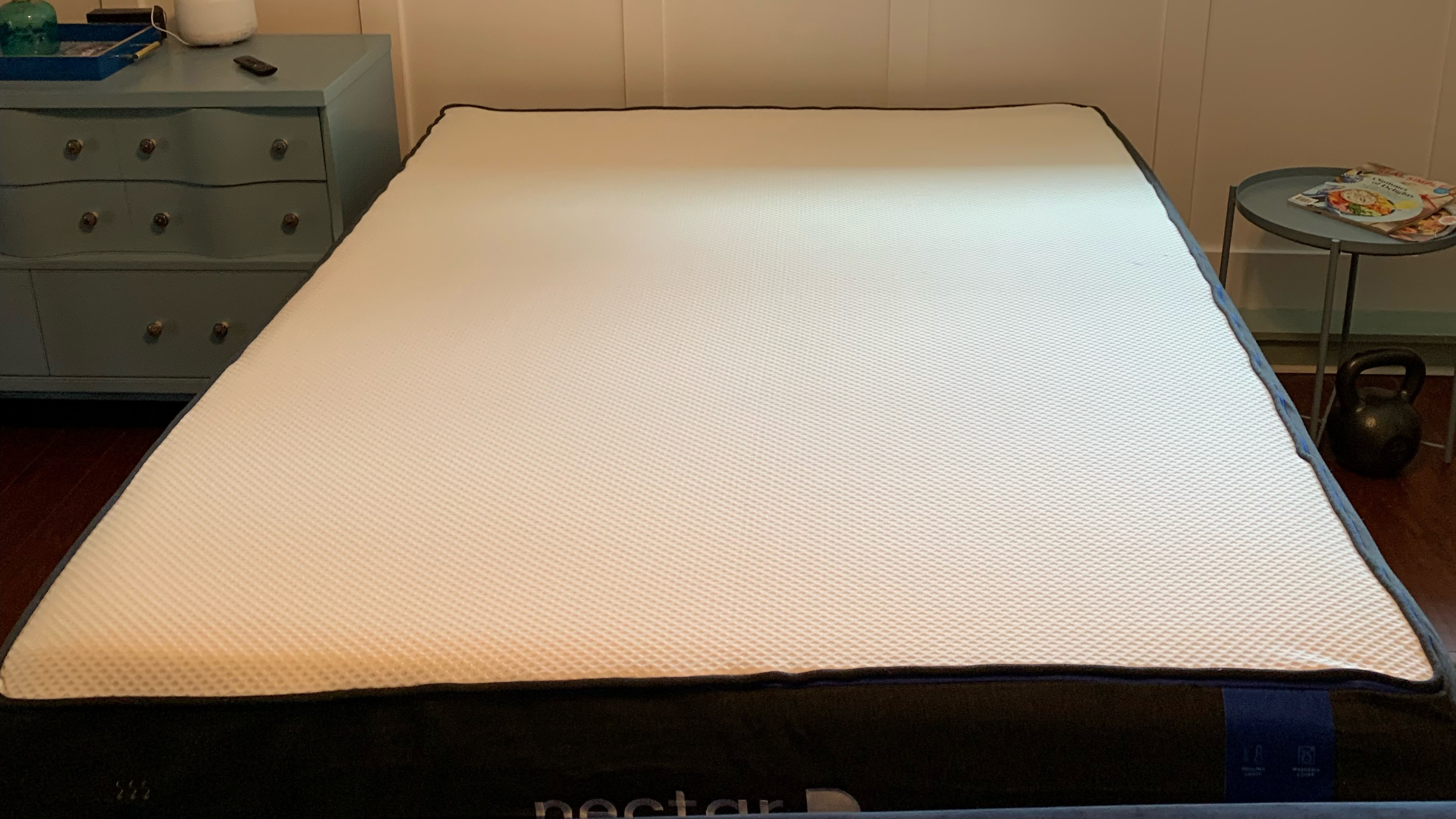 The Nectar Mattress shown on a plain black bed frame during our review and testing period