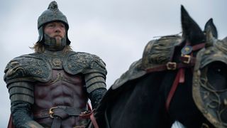 Jason Lannister (Jefferson Hall) in armor on horseback in the "House of the Dragon" season 2 finale