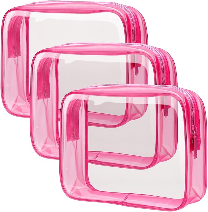 Three transparent Packism toiletry bags with pink sides and seams