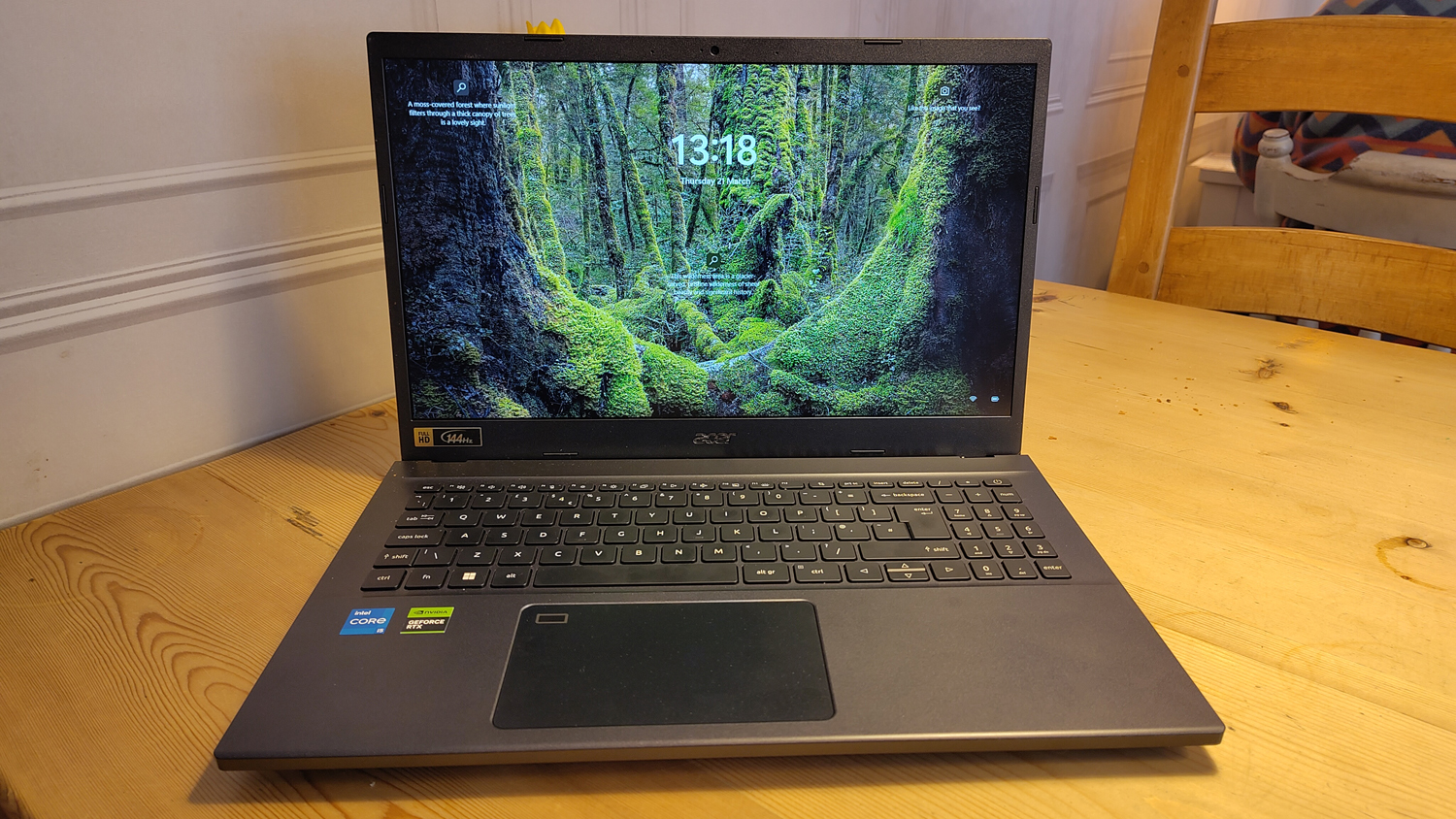 An Acer Aspire 7 sitting on a wooden desk
