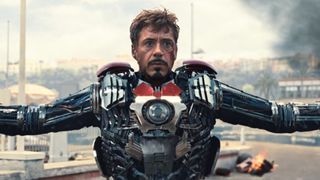 Tony Stark puts on his portable Iron Man armor in Iron Man 2