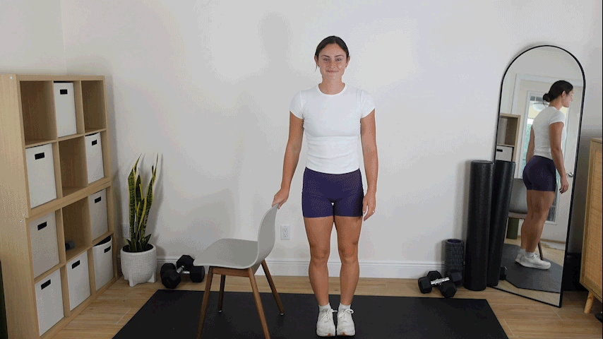 Trainer Kirra Mitlo performing a chair supported lunge