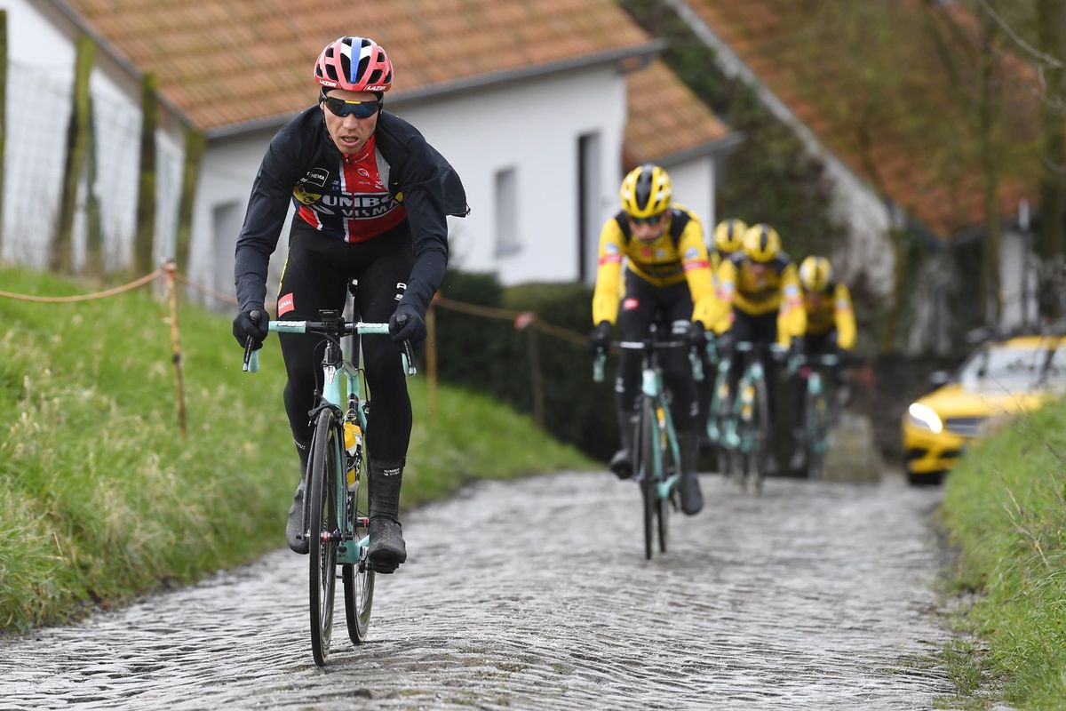 Jumbo-Visma's Amund Gr&oslash;ndahl Jansen hits a cobbled berg