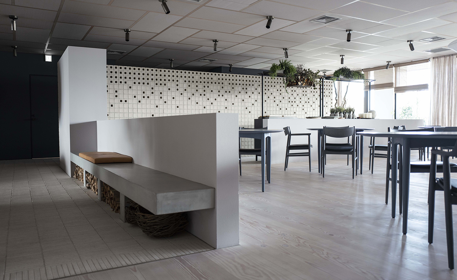 Timber and dyed concrete interiors at Inua restaurant, Tokyo, Japan