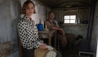 The Dig Carey Mulligan and Ralph Fiennes sitting in a shack at tea