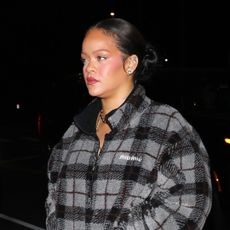 Rihanna embraces the plaid trend in a Miu Miu checked-pattern teddy fleece jacket and snakeskin boots for dinner at Italian restaurant Giorgio Baldi