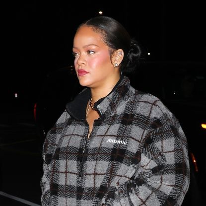 Rihanna embraces the plaid trend in a Miu Miu checked-pattern teddy fleece jacket and snakeskin boots for dinner at Italian restaurant Giorgio Baldi