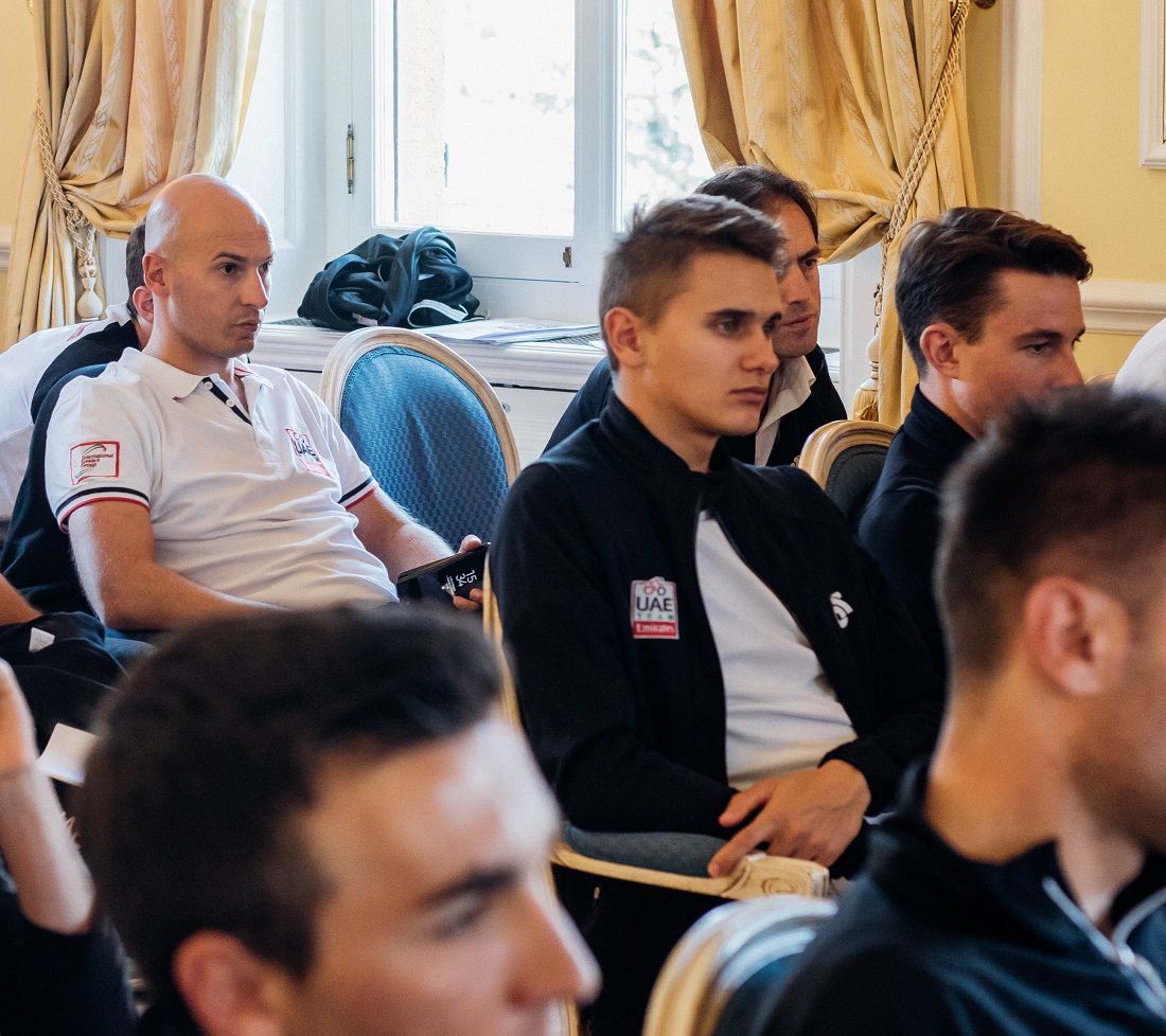Riders and directors in a meeting