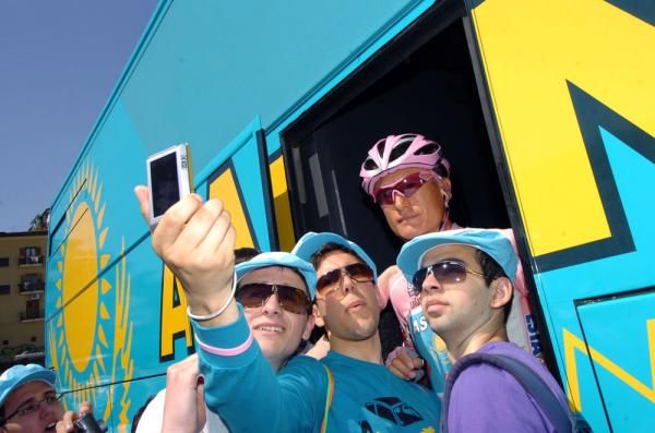 Say cheese: A few of Vinokourov's fans grab a snapshot with their hero