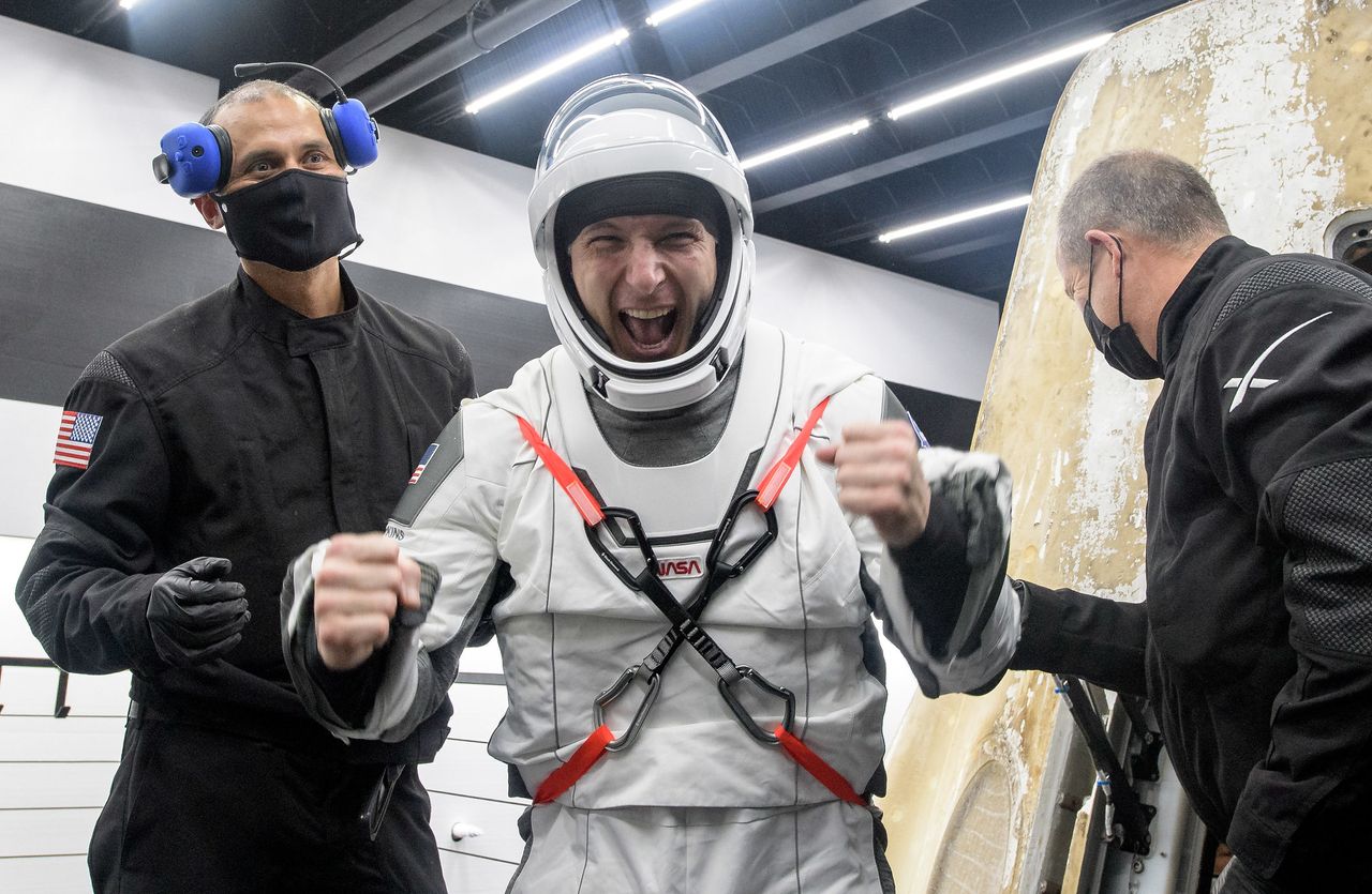 NASA astronaut Mike Hopkins celebrates after returning to Earth on SpaceX's Crew-1 Crew Dragon capsule Resilience with a splashdown in the Gulf of Mexico near Panama City, Florida on May 2, 2021.