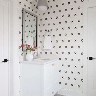 White custom vanity in mono bathroom with hearts and kisses modern design wallpaper