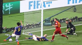 Kaoru Mitoma is adjudged to have crossed the ball before it goes completely out of play for Japan's second goal against Spain at the 2022 World Cup.